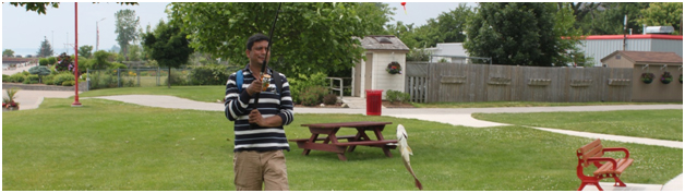 বন্ধু মাহবুবের আমাদের ২০১৪-এ Wheatley Provincial পার্কে ক্যাম্পিং এর সময় Lemington Harbor-এ ধরা মাছের গর্বিত প্রদর্শন।